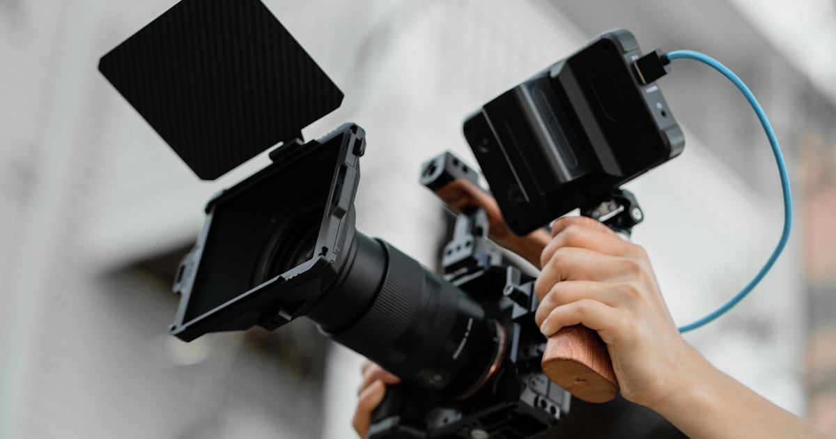 Content creator filming a video, YouTube mentions now show the strongest correlation with AI visibility at 0.737, making video content the top off-site signal for AI citation